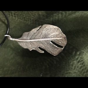 1 silver colored metal feather necklace